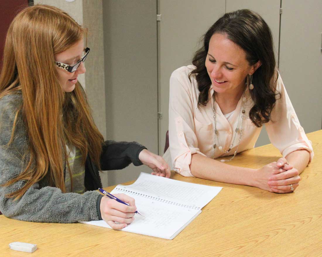 Elaine Vickers helping a student